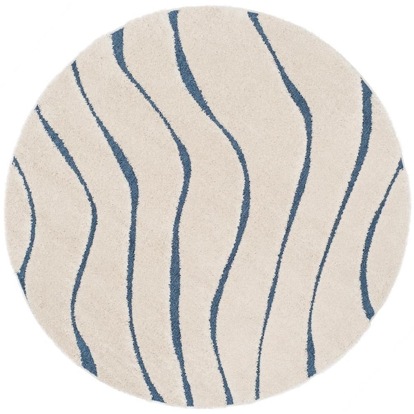 SAFAVIEH Florida Shag Cream/Blue 7 ft. x 7 ft. Round Solid Area Rug