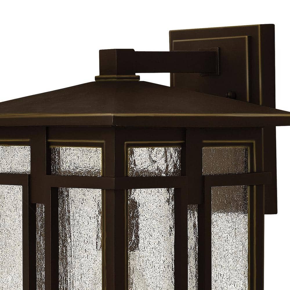 Elegant Bronze Outdoor Sconce with Clear Seedy Glass