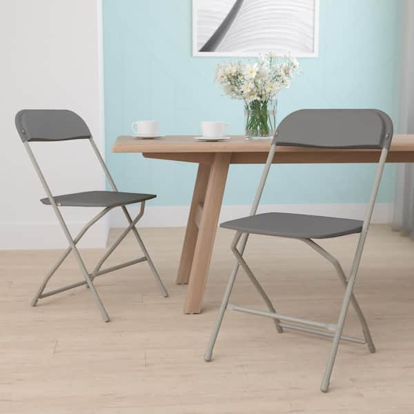 https://images.thdstatic.com/productImages/fac7b7c0-18df-44fb-80e6-9da05eb35bf4/svn/grey-carnegy-avenue-folding-chairs-cga-le-274400-gr-hd-31_600.jpg