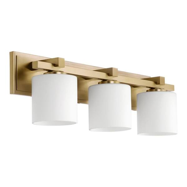 Quorum INTERNATIONAL Traditional Cylinder 24 in. W  3-Lights Aged Brass Vanity Lights with Satin Opal Glass