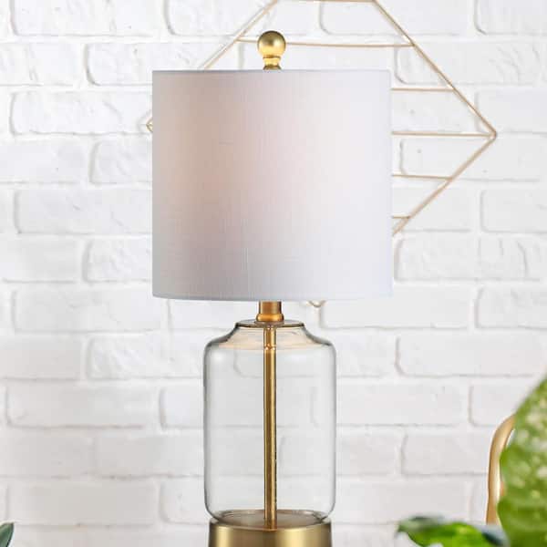 https://images.thdstatic.com/productImages/faf97d8f-9234-487e-a1c3-63d47e99c0f1/svn/brass-clear-jonathan-y-table-lamps-jyl1033a-76_600.jpg