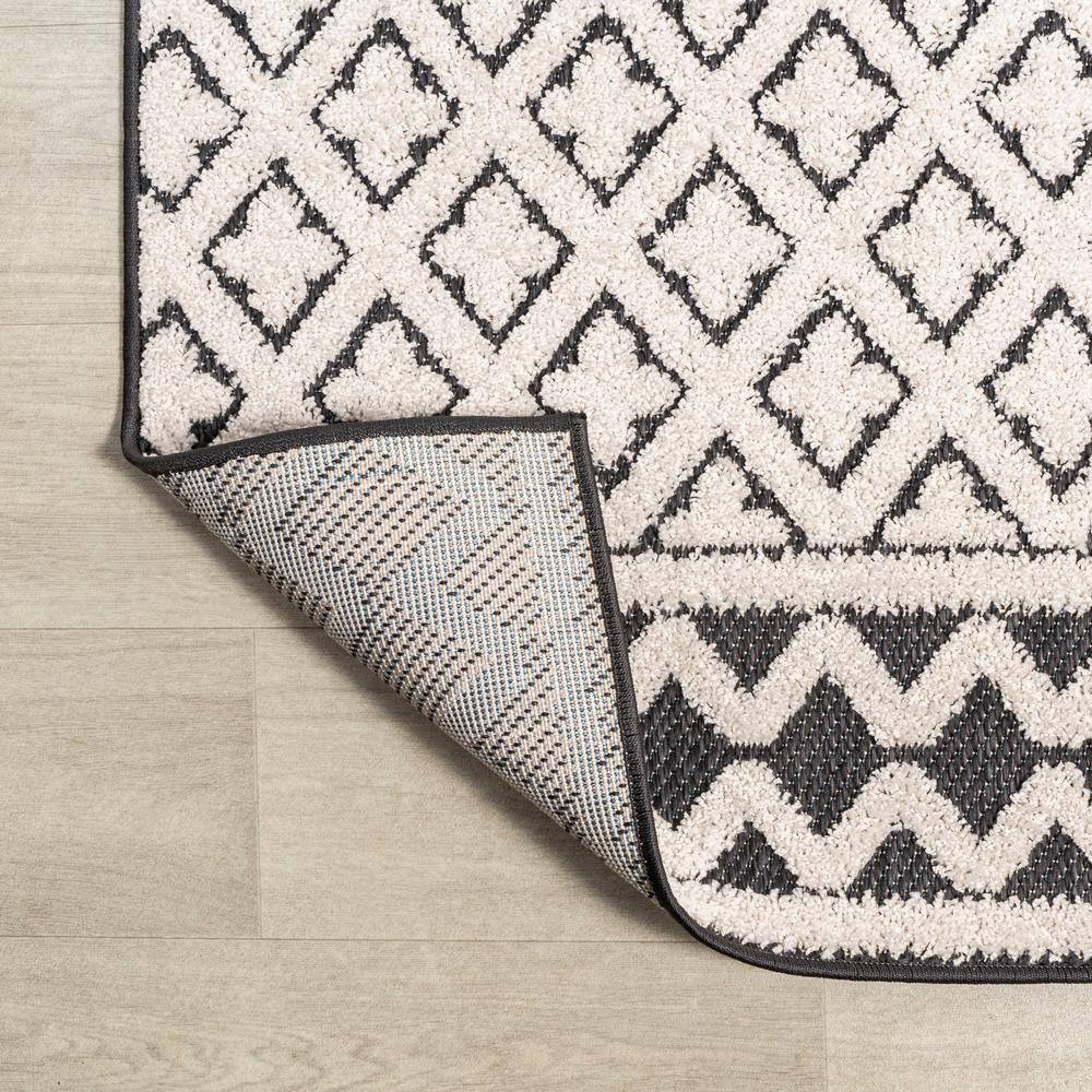 Cream and Black Geometric Synthetic Indoor/Outdoor Area Rug