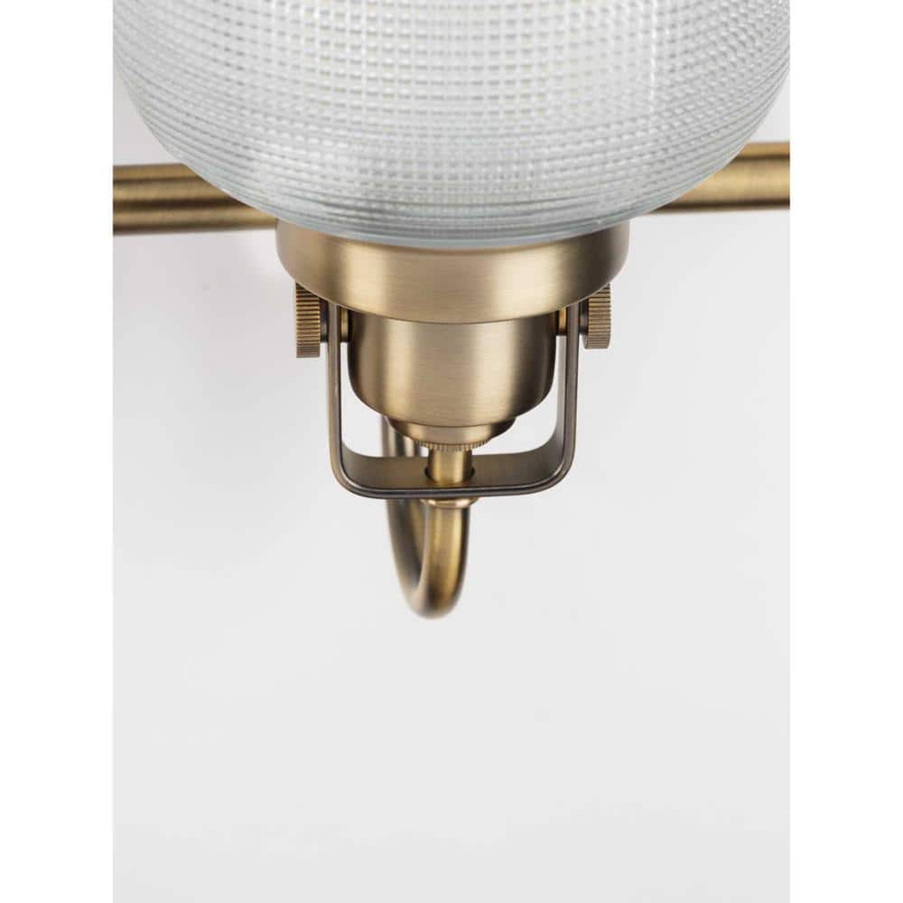 Vintage Brass Four-Light Bathroom Vanity Fixture with Prismatic Glass Shades