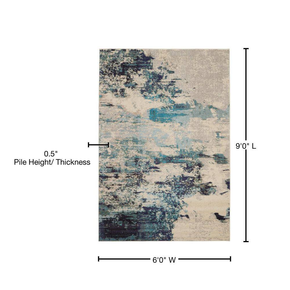 Ivory and Teal Blue Abstract 6' x 9' Synthetic Area Rug