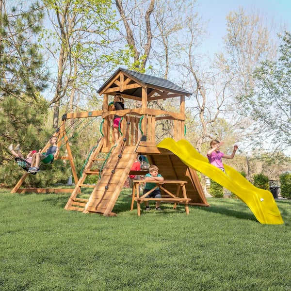 Endeavor II Outdoor Playground Set w/ Elevated Clubhouse, Climbing Wall, Yellow Wave Slide, and Picnic Bench