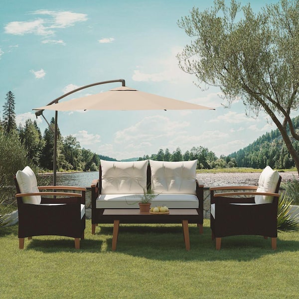 4-Piece Brown Wicker Patio Conversation Set with Beige Cushions and Pillows