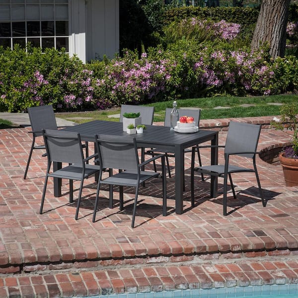 Hanover Naples 7-Piece Aluminum Outdoor Dining Set with 6 Sling Chairs and a 63 in. x 35 in. Dining Table
