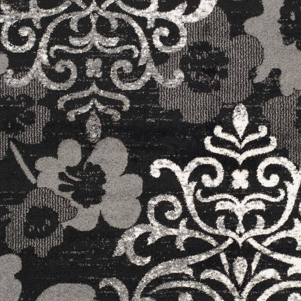 Elegant Black/Silver 9' x 12' Reversible Synthetic Area Rug