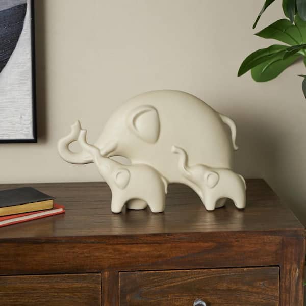 Litton Lane Cream White 14 in. x 9 in. Elephant Ceramic Sculpture with Raised Trunks