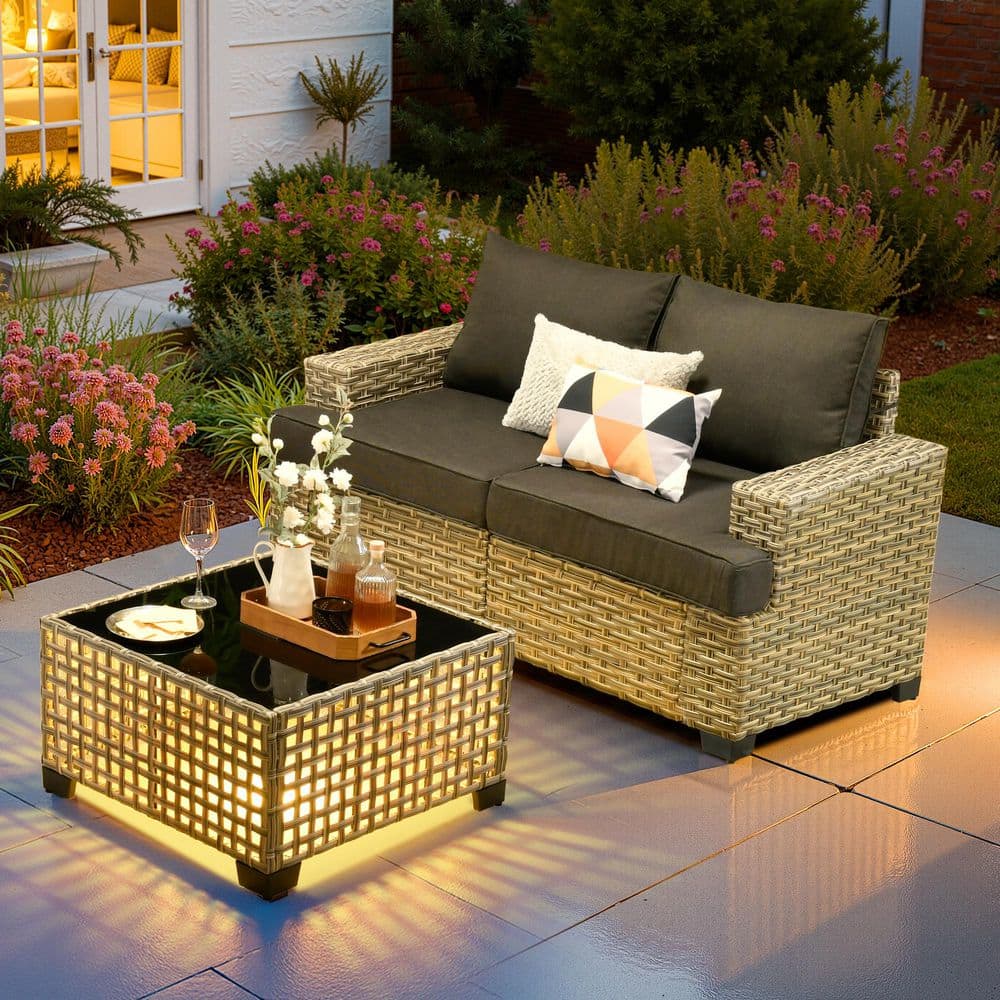 XIZZI Solstice Wicker Outdoor Couch with Black Cushions and Coffee