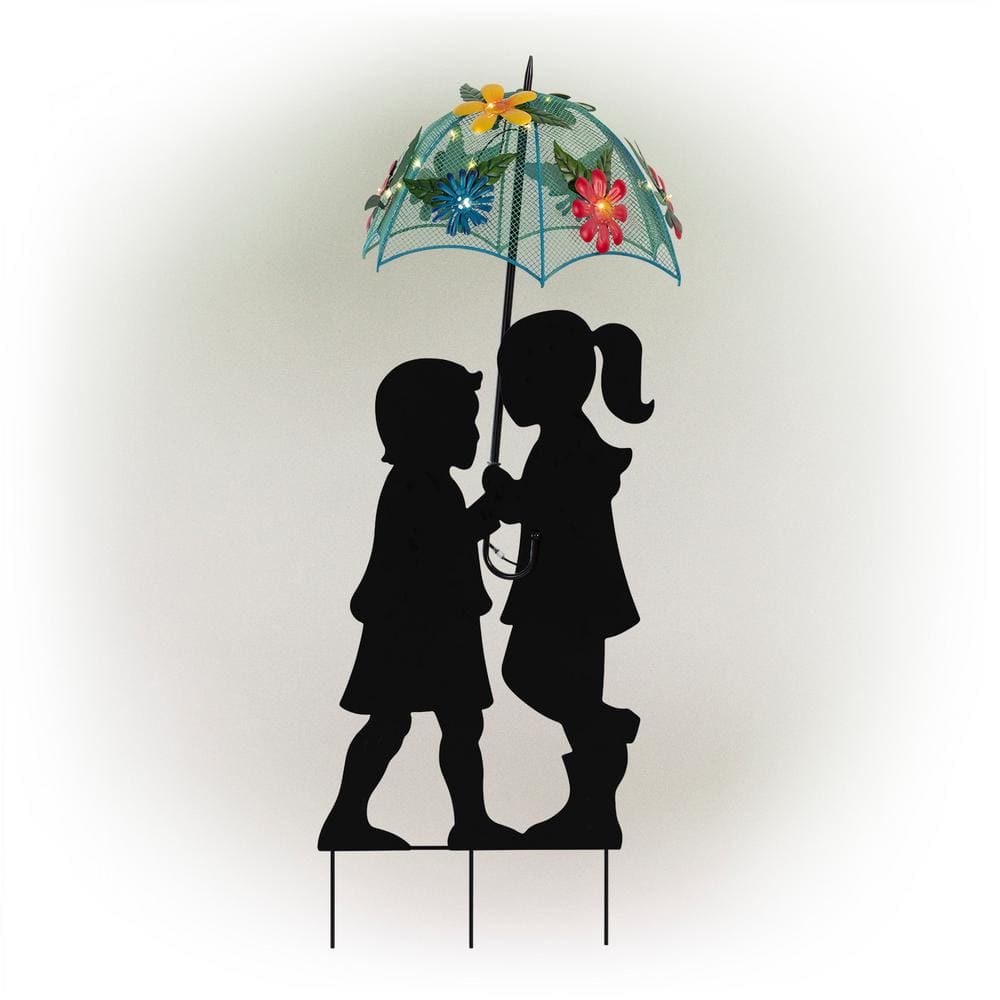 couple silhouette holding hands umbrella