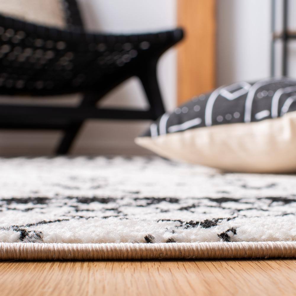 Ivory/Black Synthetic 6' x 9' Hand-Knotted Boho-Chic Area Rug