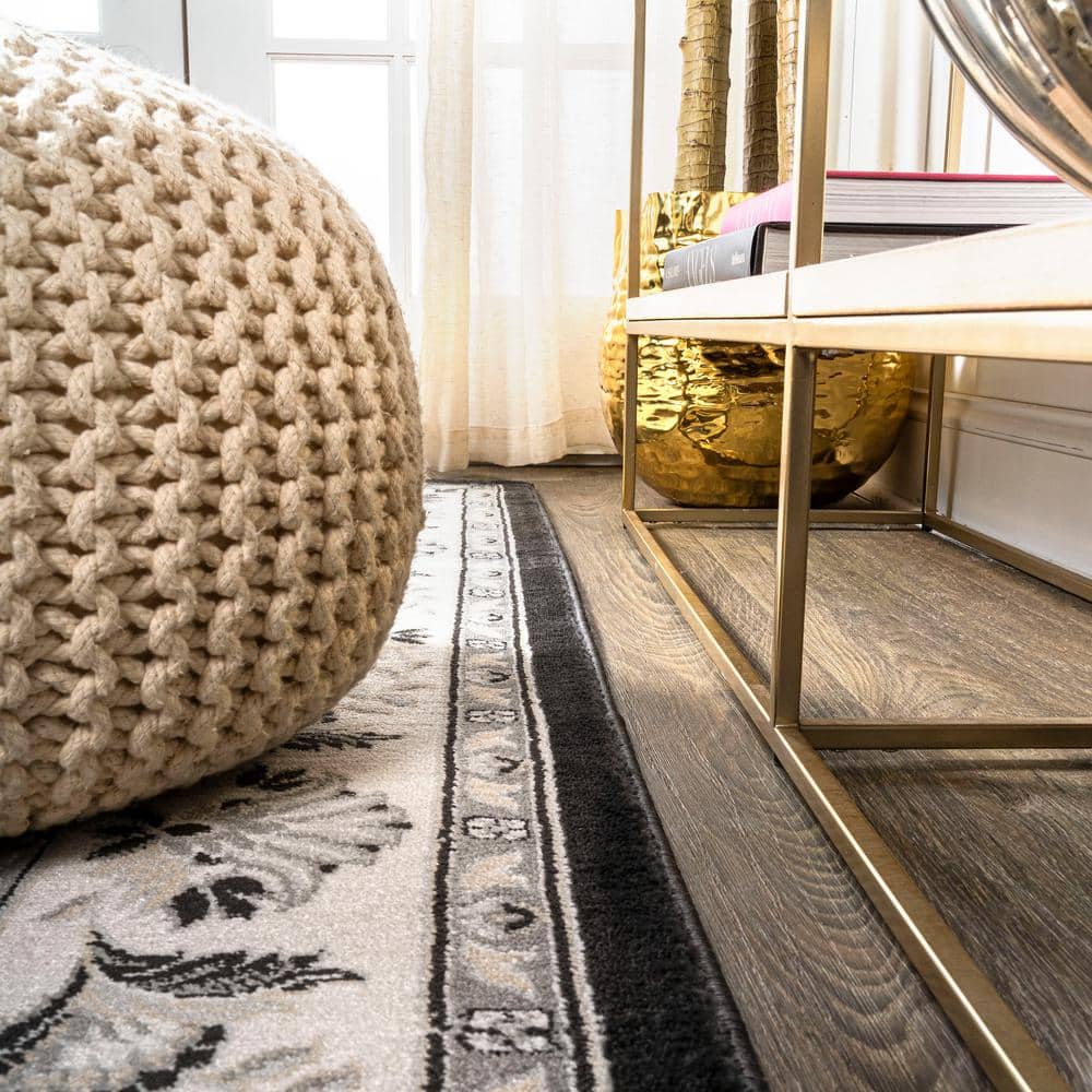 Elegant Persian-Inspired 4' x 6' Black and Cream Synthetic Rug