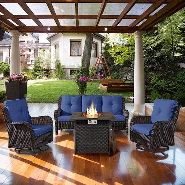 4-Piece Brown Wicker Fire Pit Conversation Set with Olefin Blue Cushions and Curved Arm Swivel Glider Chairs