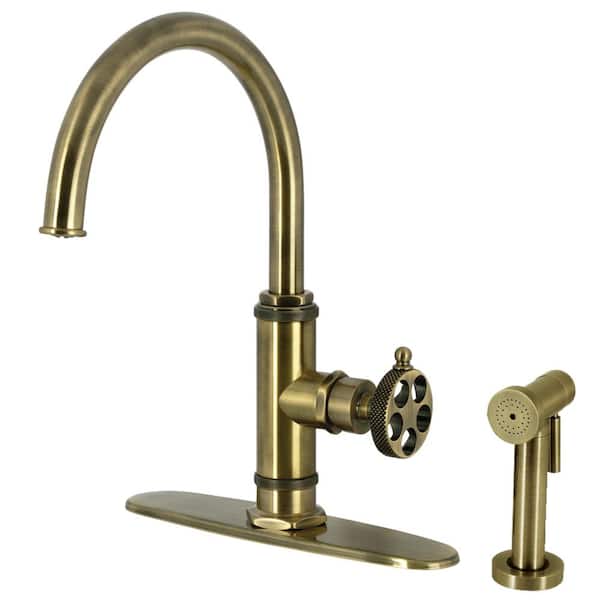 Kingston Brass Webb Deck Mount Single Handle Standard Kitchen Faucet with Sprayer in Antique Brass