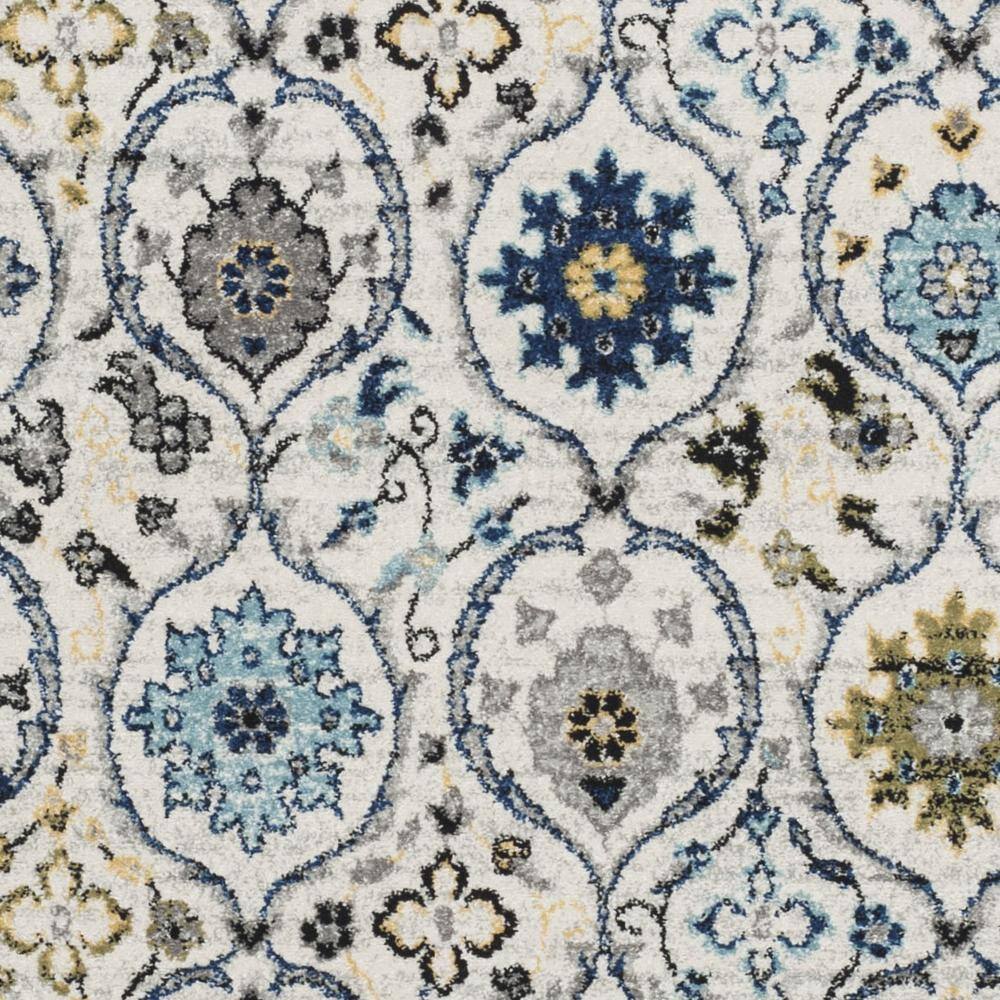 Ivory and Blue Reversible Synthetic Area Rug, 6'7" x 9'