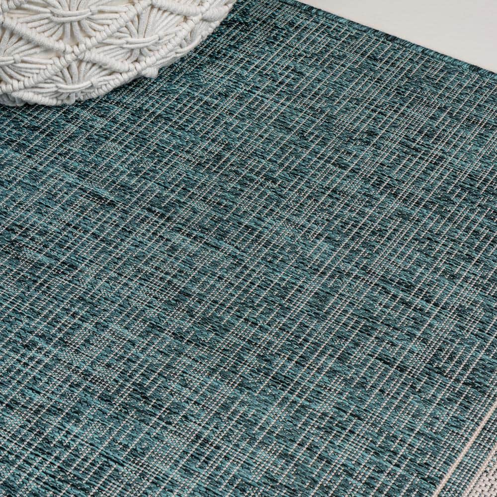 Turquoise and Cream 4' x 6' Solid Synthetic Area Rug