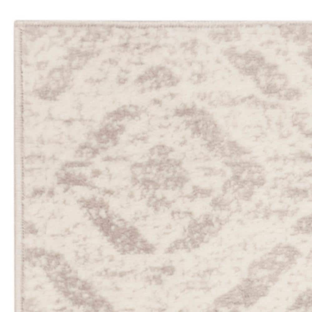 Ivory Medallion Easy-Care 2' x 6' Synthetic Runner Rug