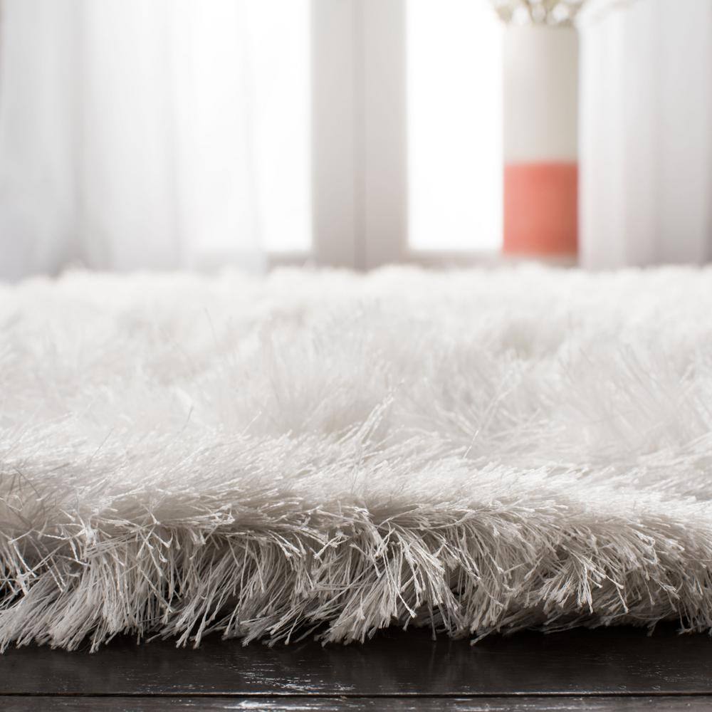 Ivory Hand-Tufted Shag Synthetic 9' x 12' Area Rug