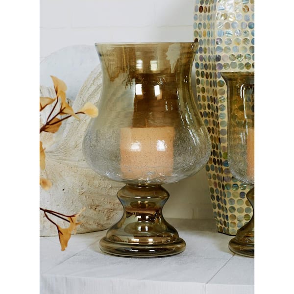 https://images.thdstatic.com/productImages/fda9ab79-a730-4343-9a75-627d365d4eaf/svn/clear-litton-lane-candle-holders-24671-31_600.jpg