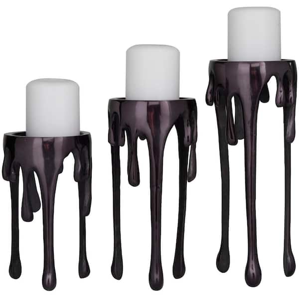 https://images.thdstatic.com/productImages/fdafb98d-74ab-4d51-b81a-ca863498db3f/svn/black-cosmoliving-by-cosmopolitan-candle-holders-042780-4f_600.jpg