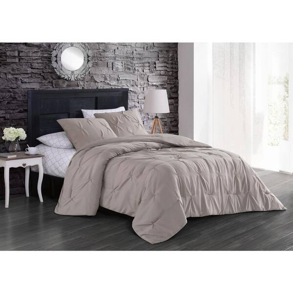 Pretty pale pink coloring with floral pintuck ruffles. flynn 7 piece taupe king comforter set