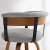 Side view of a gray fabric bar stool.
