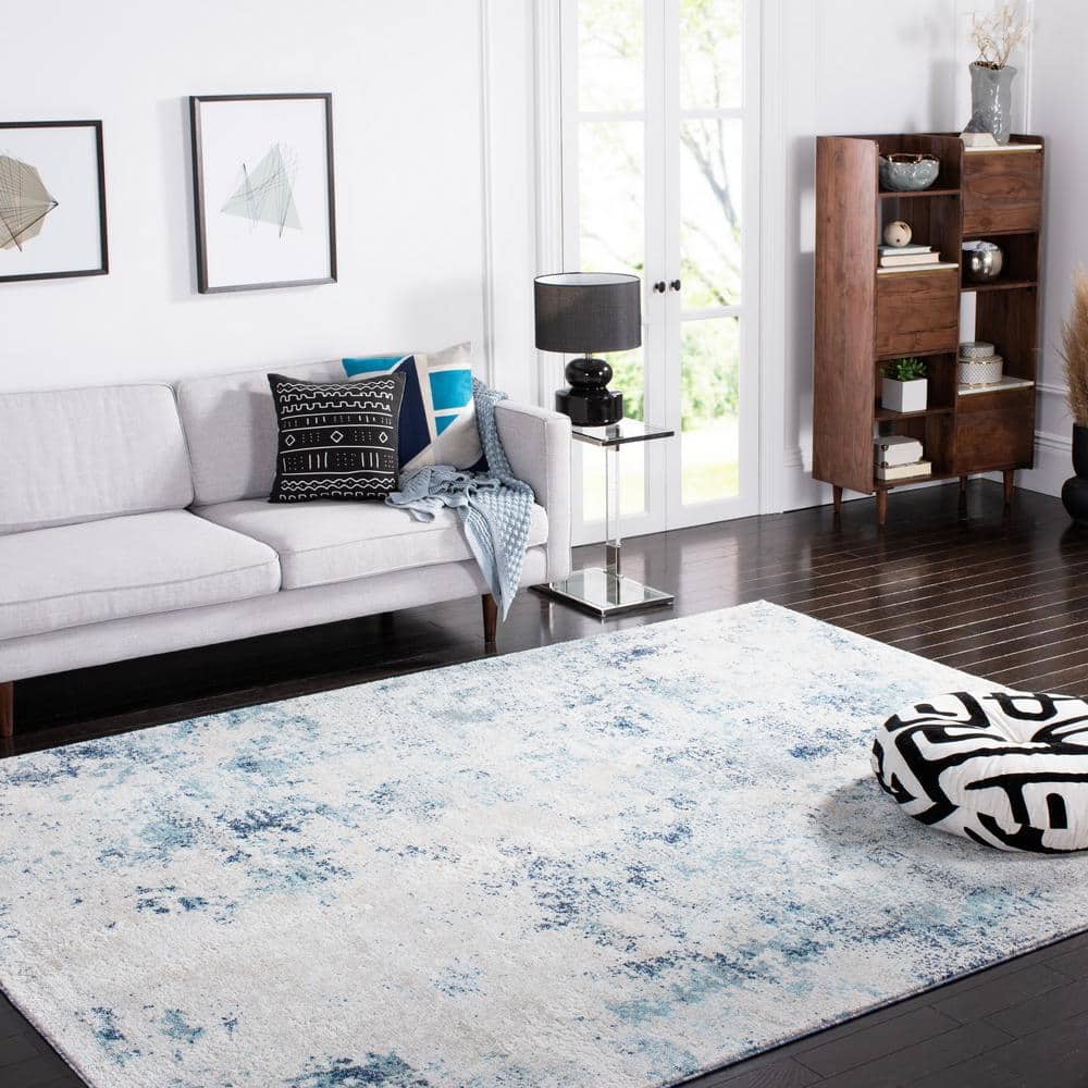 Ivory and Blue Abstract 9' x 12' Stain-Resistant Rug