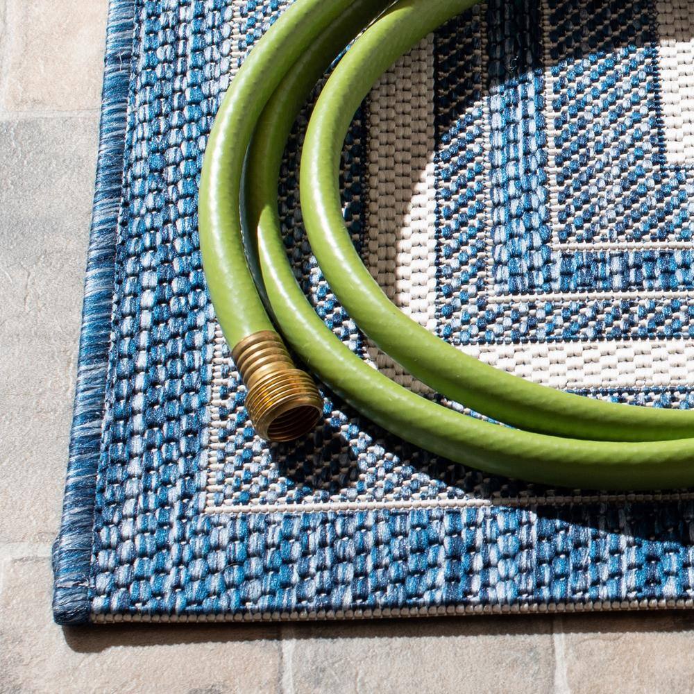 Ivory and Navy Rectangular Synthetic Indoor/Outdoor Rug