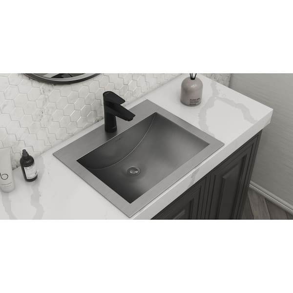 https://images.thdstatic.com/productImages/fe6c52b6-0b46-4007-a580-2e2e9f2c4469/svn/brushed-stainless-steel-ruvati-drop-in-bathroom-sinks-rvh5110st-31_600.jpg