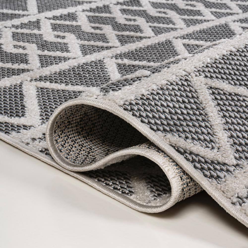 Aylan Black/Ivory Geometric High-Low Pile Synthetic Indoor/Outdoor Rug