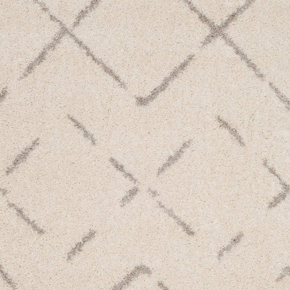 Ivory and Beige Geometric Shag 8' x 10' Area Rug
