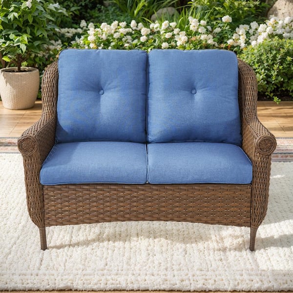 Brown PE Wicker Outdoor Loveseat with Blue Cushions and Chrysanthemum Armrest