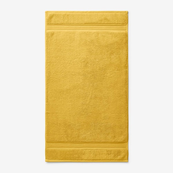 https://images.thdstatic.com/productImages/feba718e-d5d1-421b-bdcb-a37bb2add412/svn/deep-yellow-the-company-store-bath-towels-vk37-mat-deep-yellow-64_600.jpg