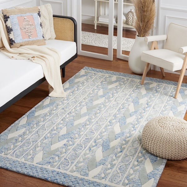 https://images.thdstatic.com/productImages/fece2956-fa53-45a2-8bf9-974f5563ce8e/svn/blue-ivory-safavieh-area-rugs-met863m-8-e1_600.jpg