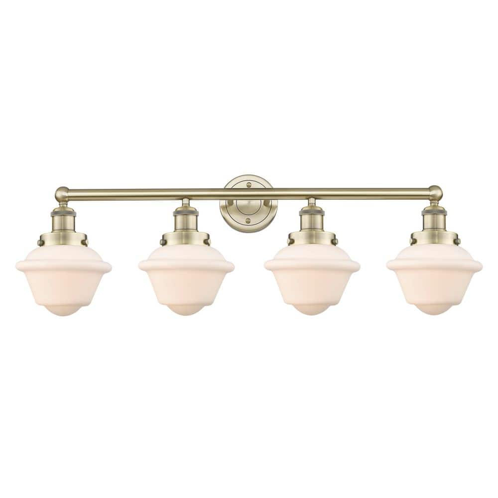 Oxford 33.5 in. 4-Light Antique Brass Vanity Light with Glass Shade price history on PriceWatchPro