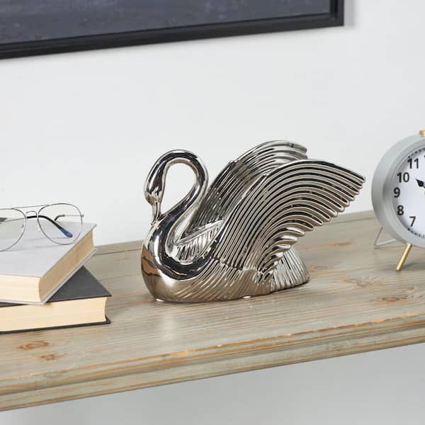 Litton Lane 7 in. x 8 in. Silver Ceramic Swan Sculpture with Textured Grooves