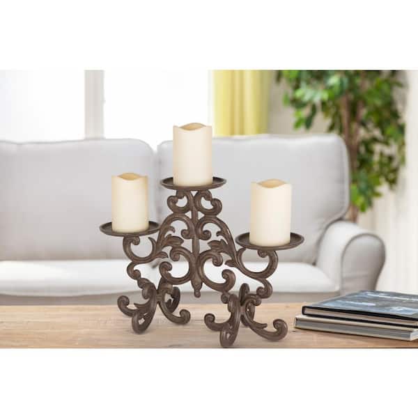 https://images.thdstatic.com/productImages/fef258a6-8598-44ff-853c-9a84abccbca8/svn/brown-gg-collection-candle-holders-90796-64_600.jpg