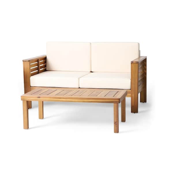 Noble House Dearing Teak Acacia Wood Loveseat and Coffee Table Set with Cream Cushions
