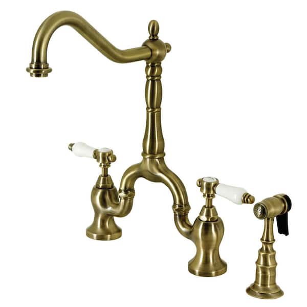 Kingston Brass Bel-Air Double-Handle Deck Mount Bridge Kitchen Faucet with Brass Sprayer in Antique Brass