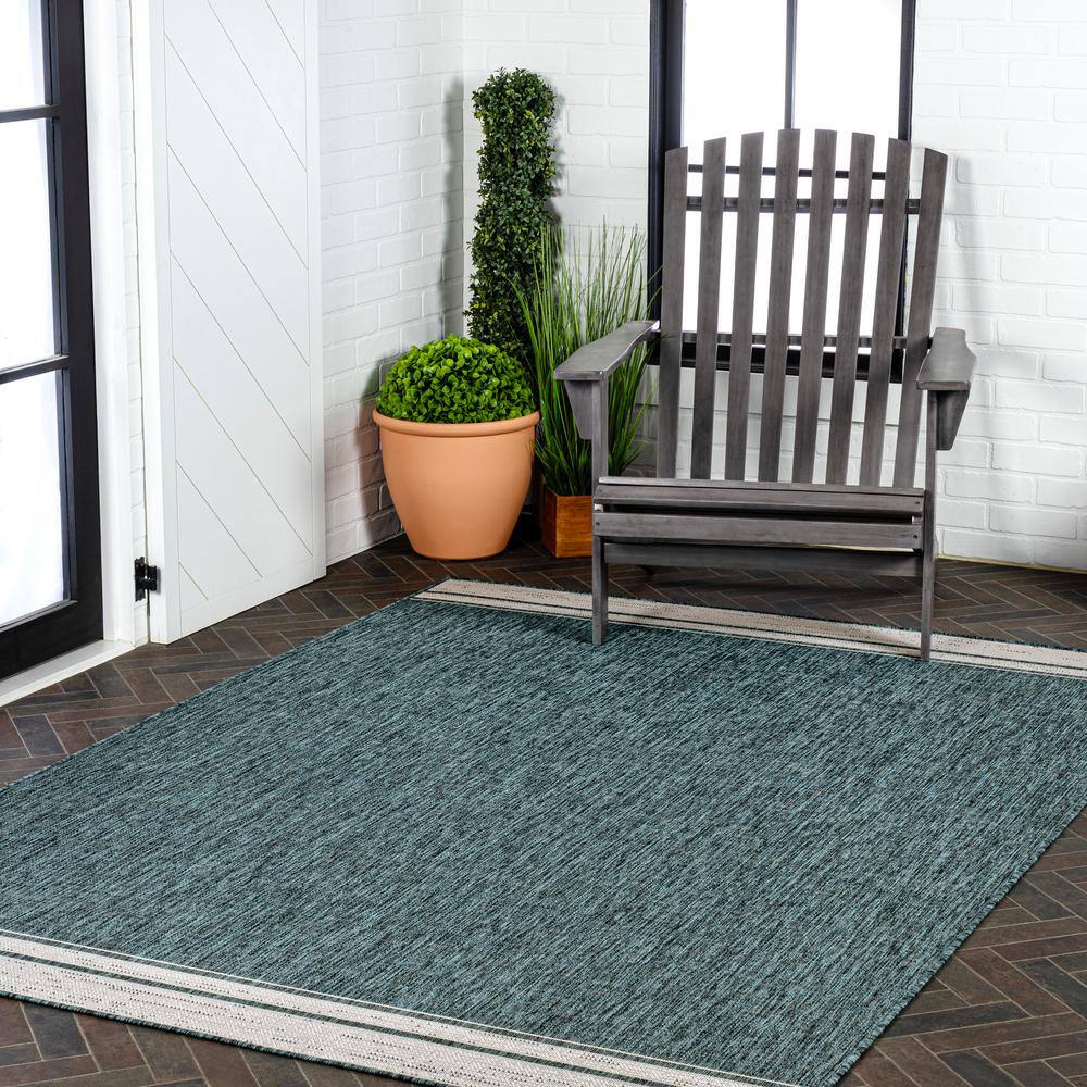 Turquoise and Cream 4' x 6' Solid Synthetic Area Rug