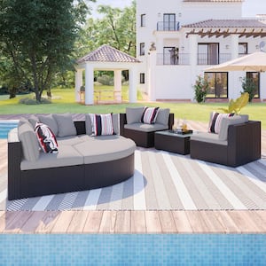 7-Piece Brown Wicker Outdoor Sectional Set with Colorful Pillows and Light Gray Cushions
